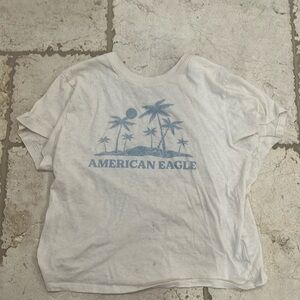 This is American Eagle top size small for girls with cream and blue colors
